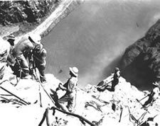 Photo. Surveyors on the canyon wall.
